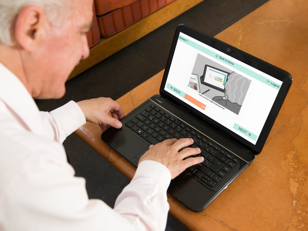 elderly man with hp laptop at home